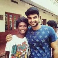 supporting young actor in malayalam karthik vishnu and tovino thomas in guppy rerelease function